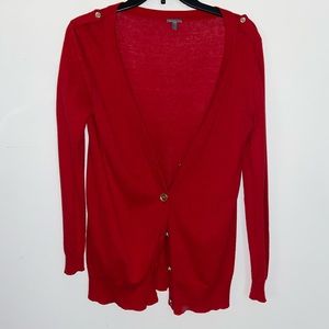 Red cardigan, gold button detail